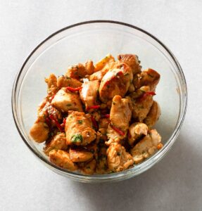 Cooked chicken chunks in a bowl.