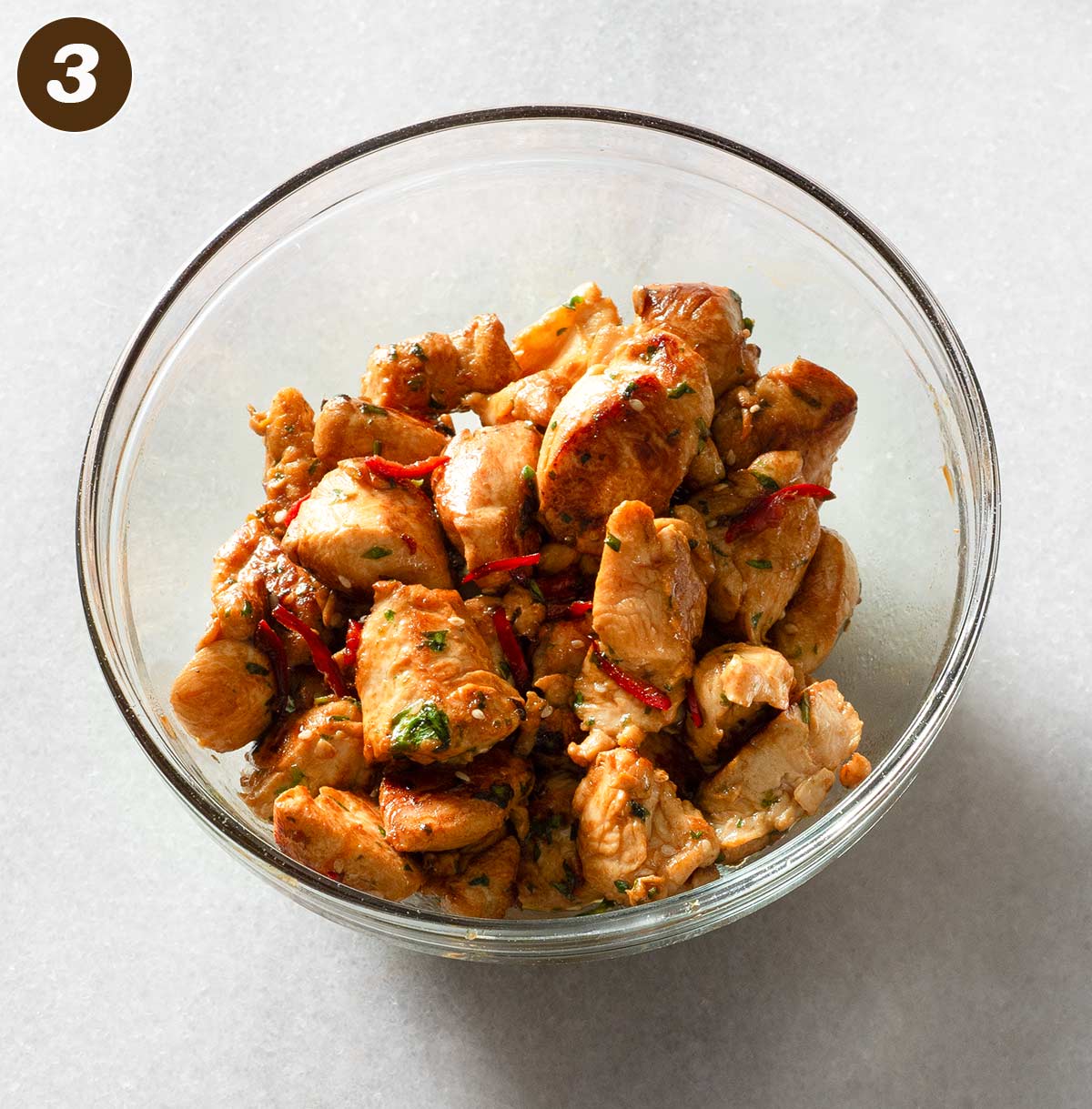 Cooked chicken chunks in a bowl.