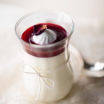 Bavarian cream in a jar with raspberry topping.