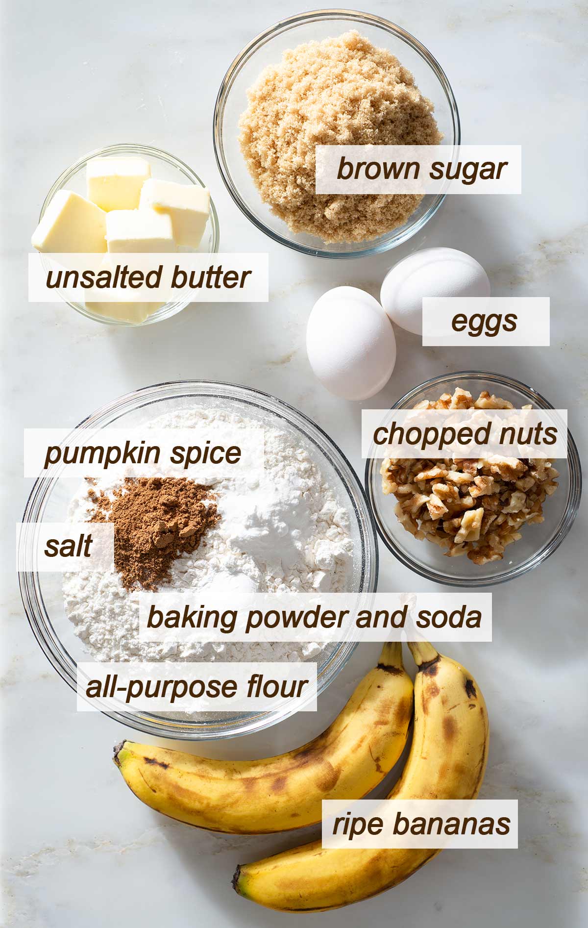 Pumpkin spice banana bread ingredients on a table.