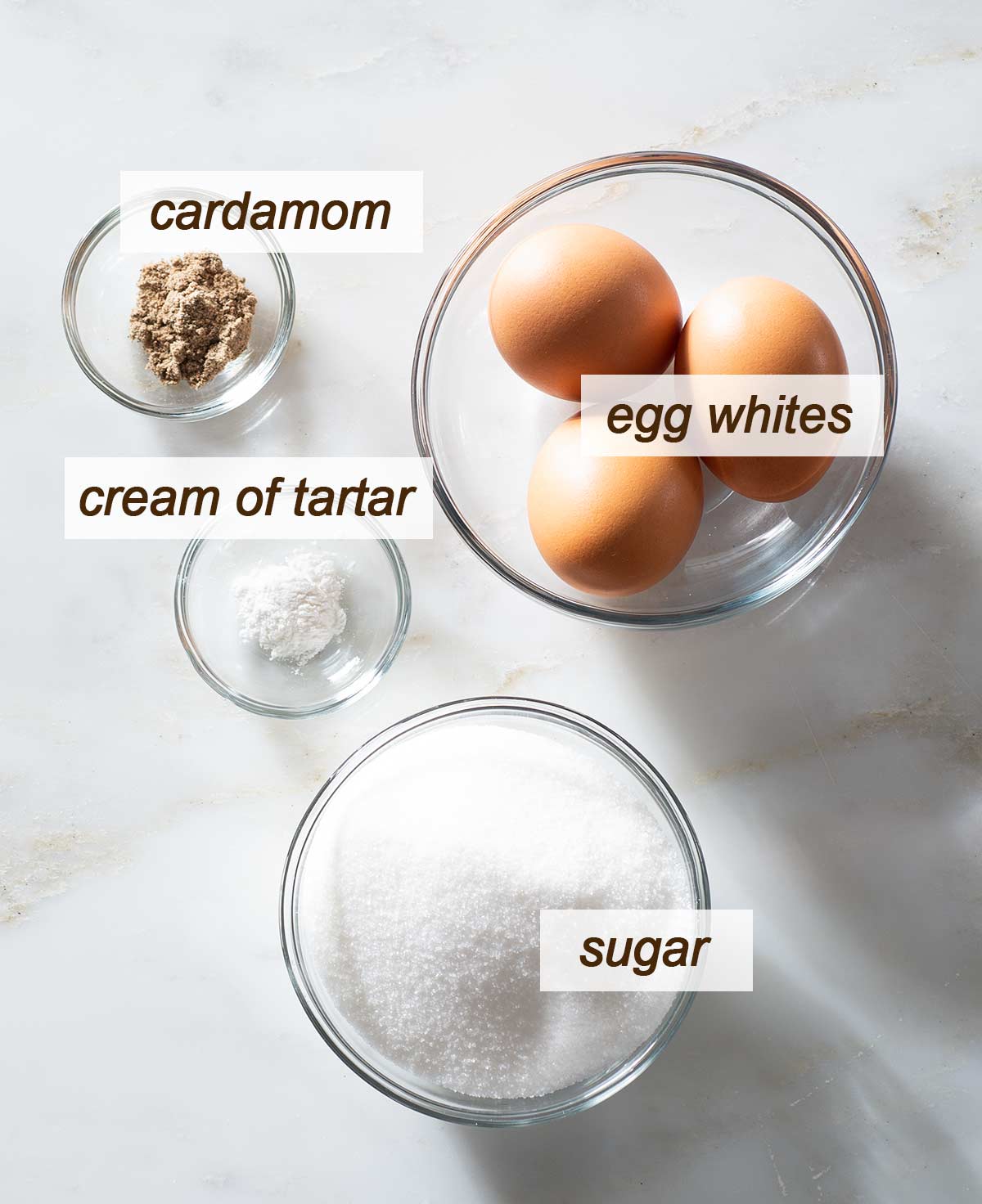 Cardamom meringue cookie ingredients on a table.
