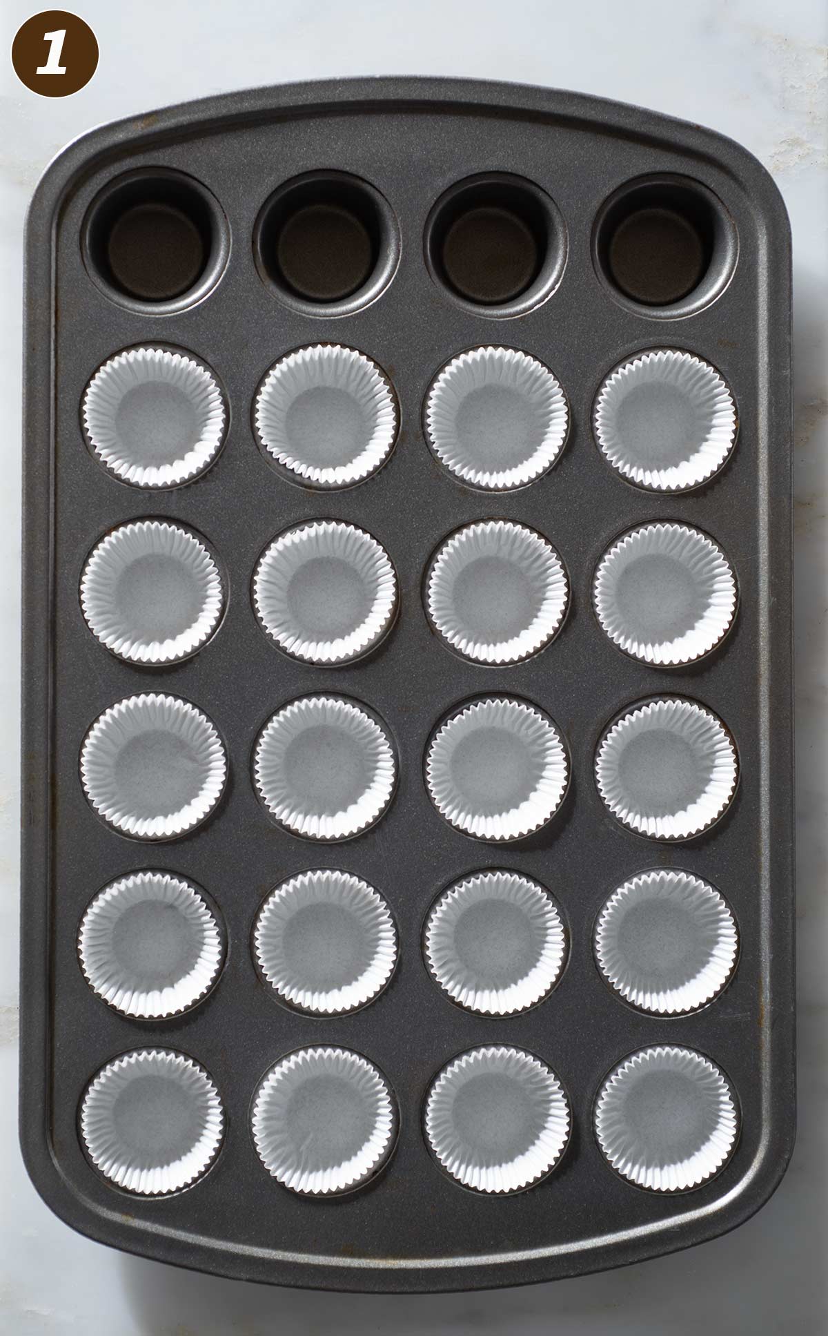 Mini cupcake pan with liners.