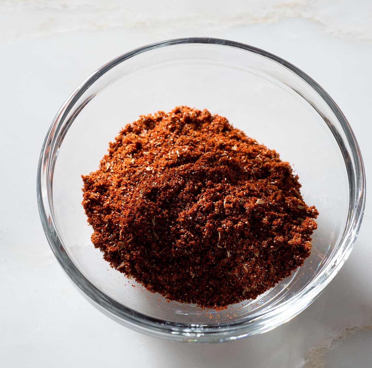 Homemade chili powder in a glass bowl.