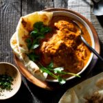 Creamy tomato chicken curry in a bowl.