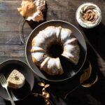 Chai spice bundt cake with fall decorations.