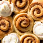 Cinnamon rolls with apricot cream cheese frosting.