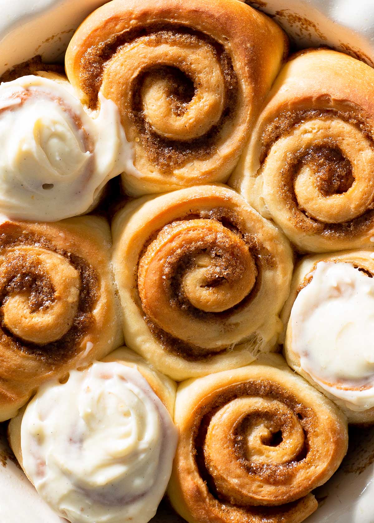 Cinnamon rolls with apricot cream cheese frosting.