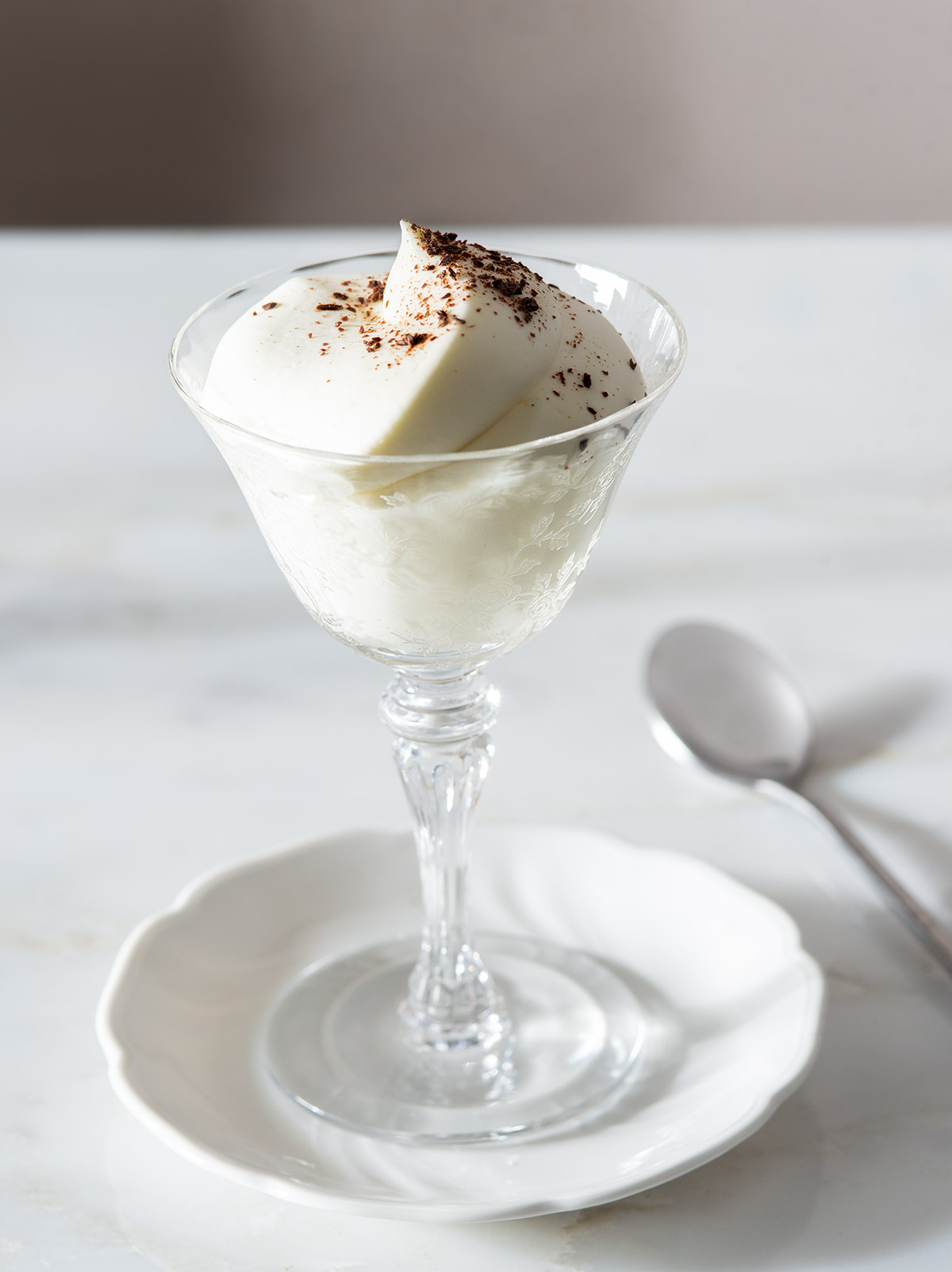 White chocolate mousse in a fancy glass.