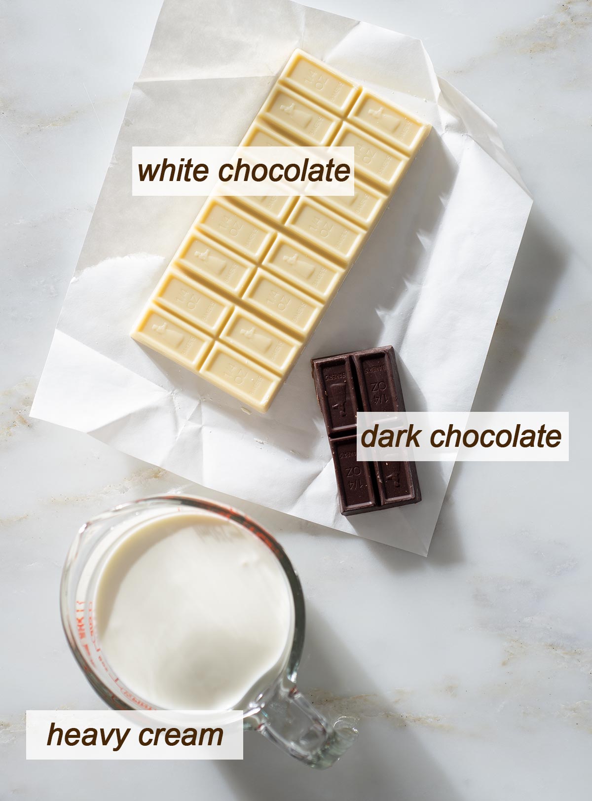 White chocolate, dark chocolate and a cup of heavy cream.