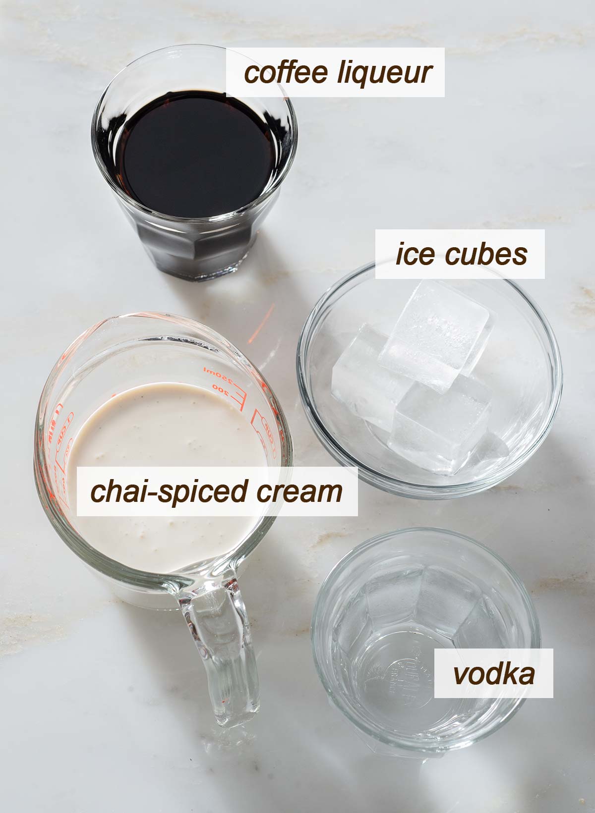 Chai white Russian ingredients on a table.