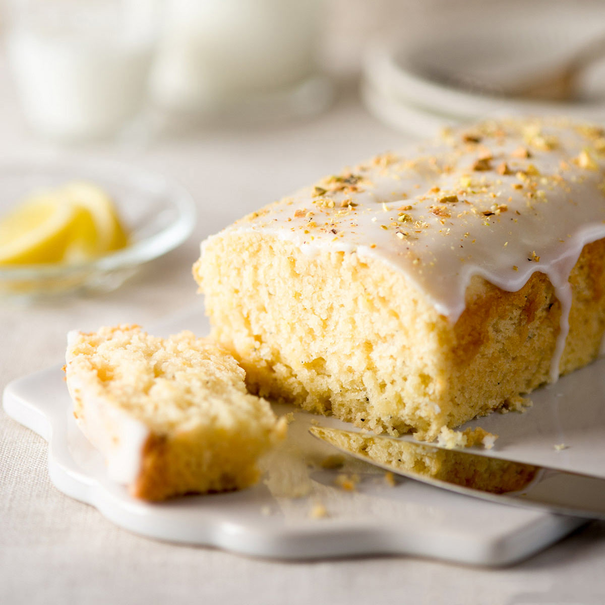 Lemon cardamom cake on a cutting board.