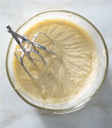 Lemon cardamom cake batter in a mixing bowl.