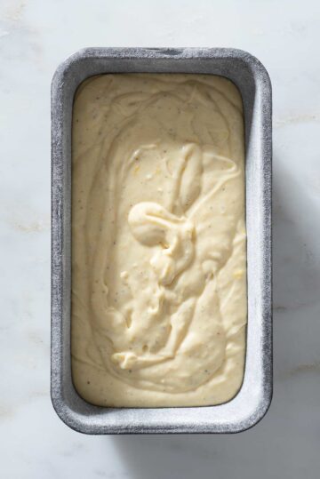 Cake batter in a loaf pan.