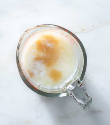 Wet ingredients in a liquid measuring cup.