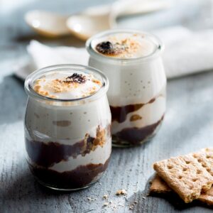 Two pumpkin spice s'mores trifles in jars.