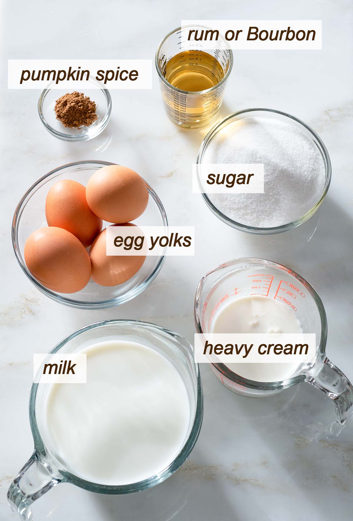 Spiced eggnog recipe ingredients on a table.