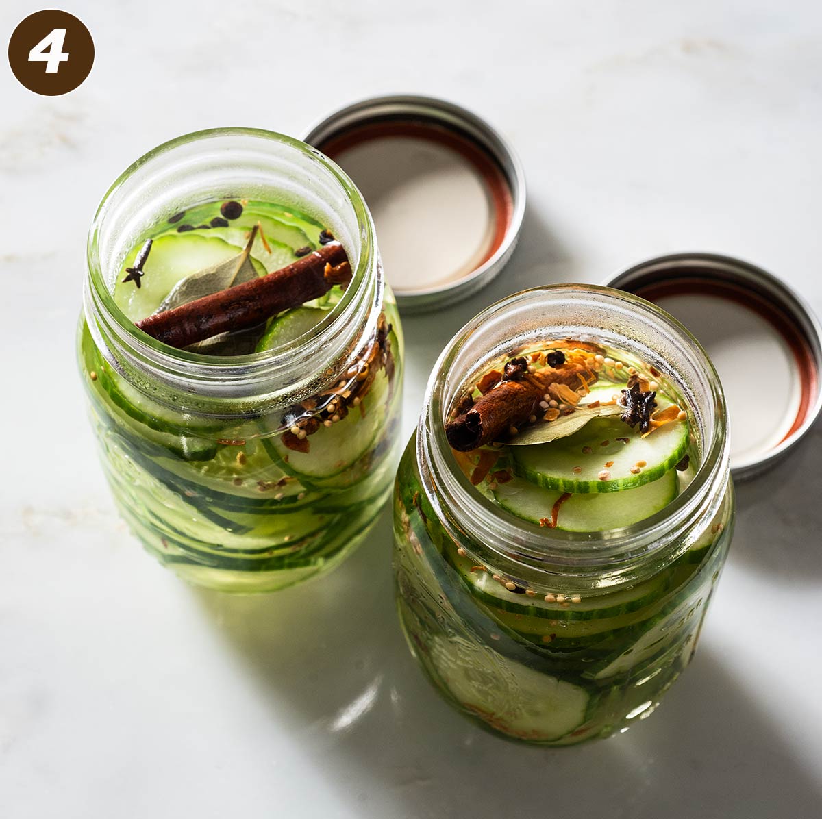 Two jars with spiced sweet pickles.
