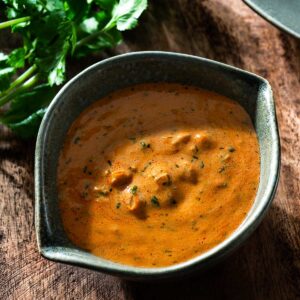 Paprika sauce in a bowl with cilantro.