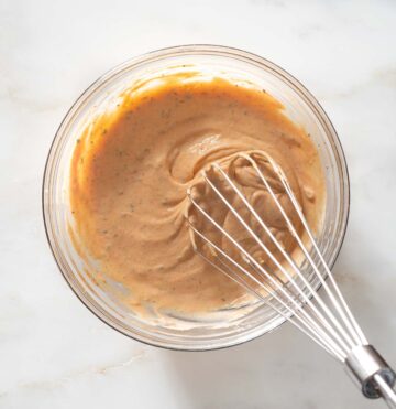 Burger sauce being whisked in a bowl.