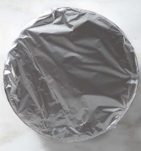 A baking dish covered with aluminum foil.