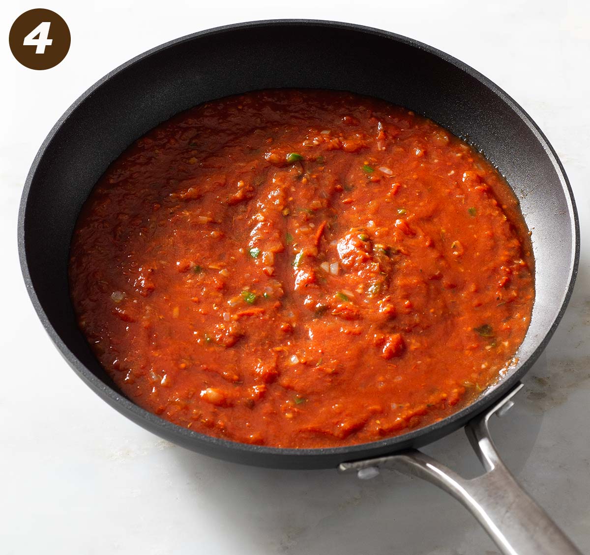 Red pasta sauce in a pan.