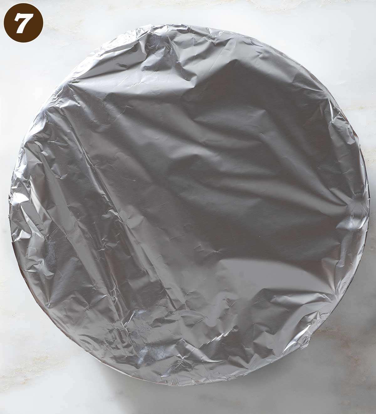 A baking dish covered with aluminum foil.