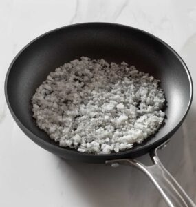 Sauteed onion in a nonstick pan.