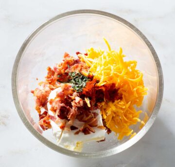 Cream cheese and bacon filling ingredients in a bowl.