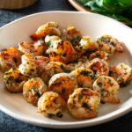 Basil shrimp on a plate.