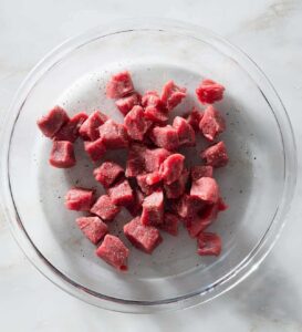 Raw steak chunks.