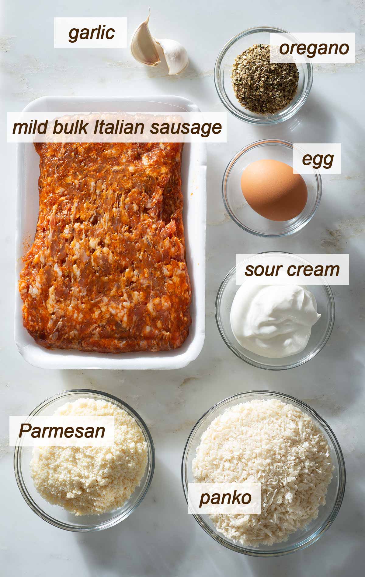 Garlic, oregano, egg, sour cream, Parmesan, panko and sausage meat.