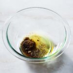 Mediterranean chicken marinade ingredients in a bowl.