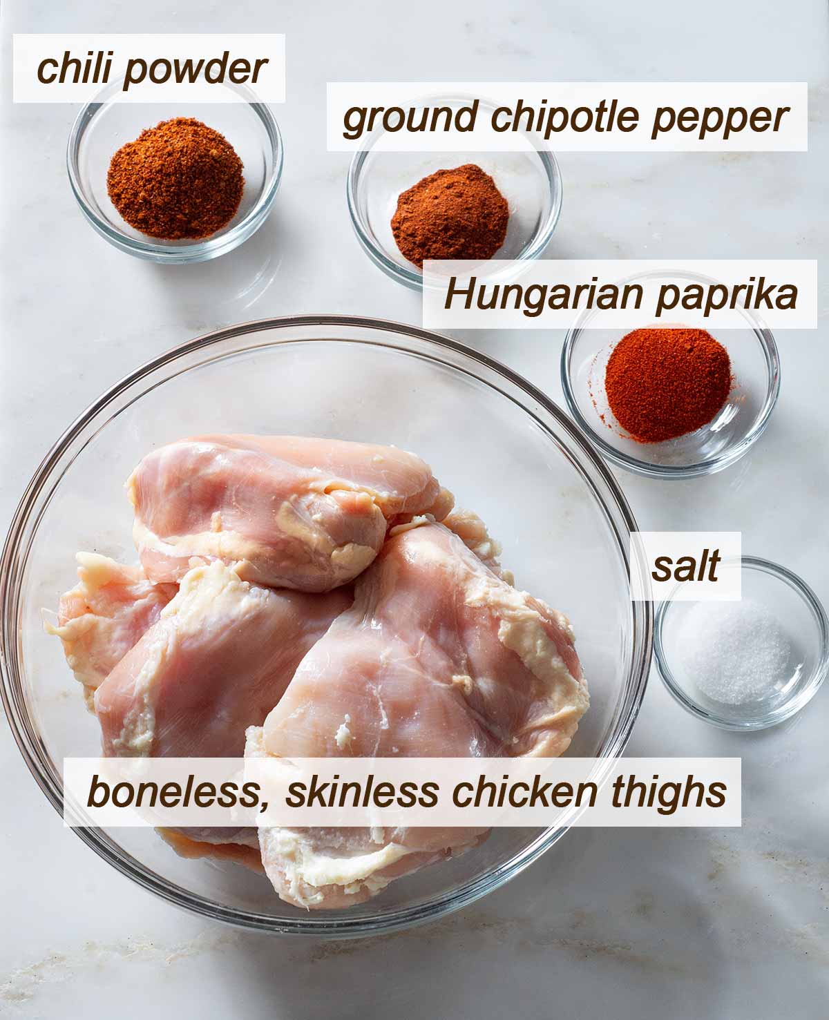 Ingredients for pulled chicken thighs on a table.