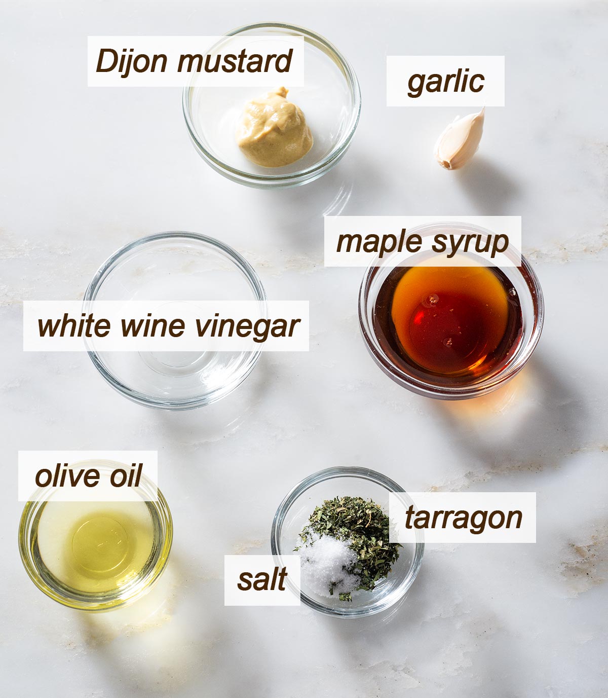 Dijon, garlic, maple syrup, white wine vinegar, olive oil, salt and tarragon.