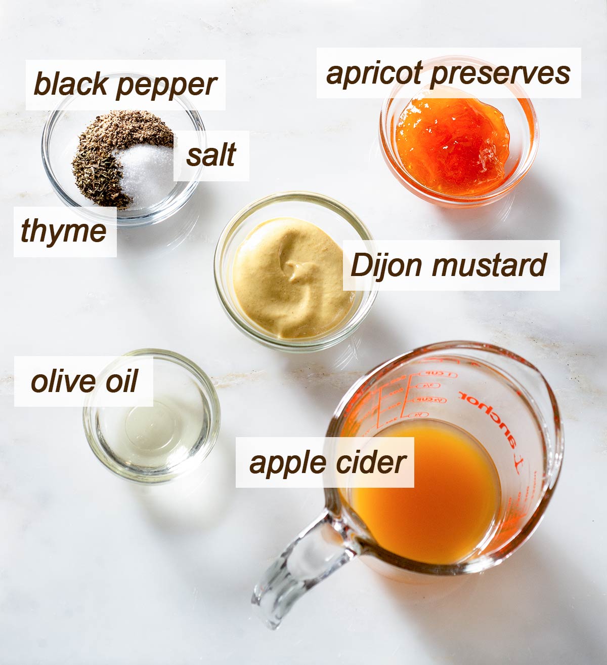 Pepper, apricot preserves, salt, thyme, Dijon, oil and apple cider.