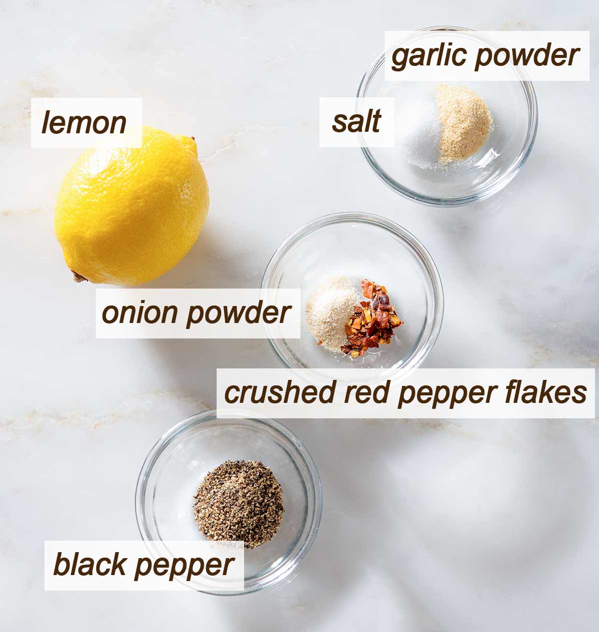Lemon pepper chicken seasoning ingredients on a table.