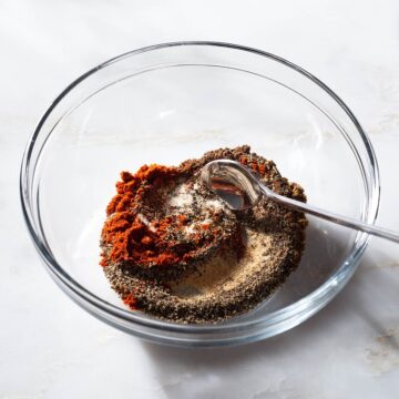 Dry rub ingredients being stirred in a bowl.