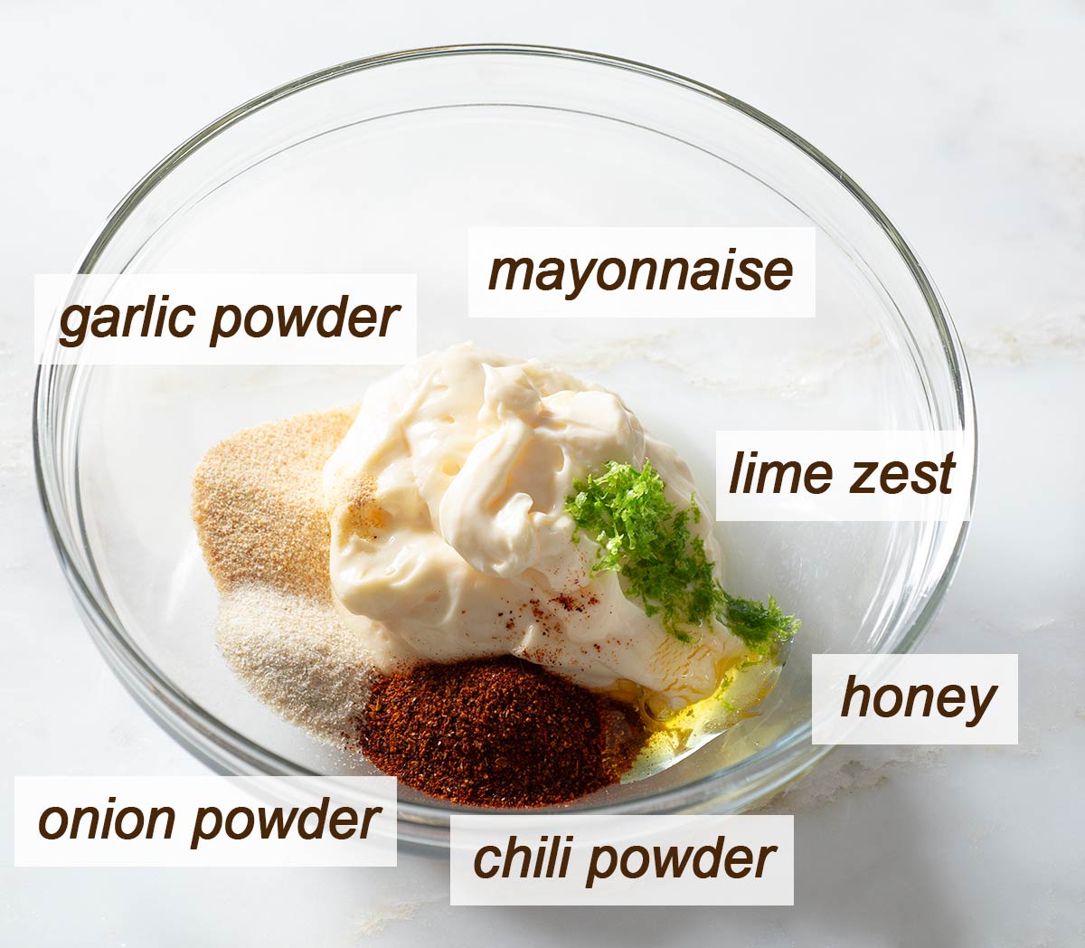 Mayonnaise, lime zest, honey, chili powder, onion powder and garlic powder.