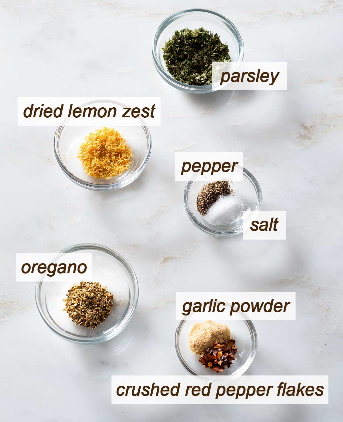 Parsley, dried lemon zest, pepper, salt, oregano, garlic powder and pepper flakes.