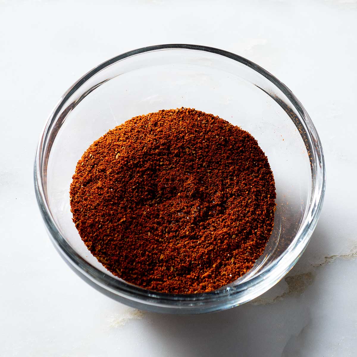 Cinnamon chili spice rub in a glass bowl.