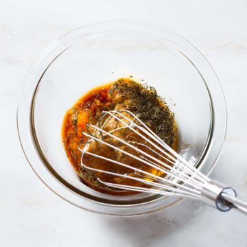 Apricot marinade ingredients being whisked in a bowl.