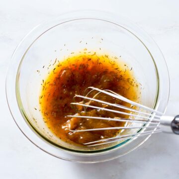 Apricot marinade being whisked in a bowl.