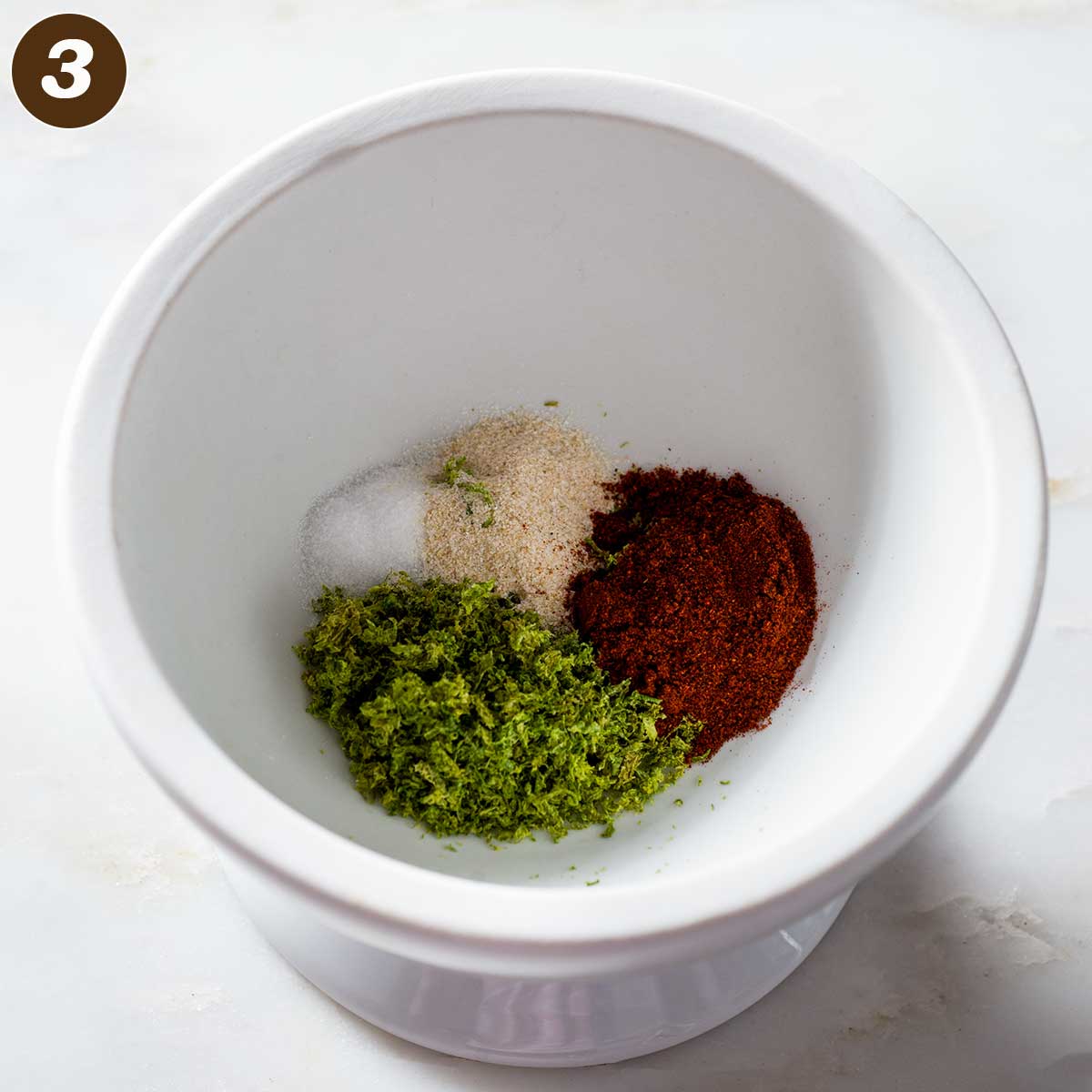 Chipotle lime seasoning ingredients in a mortar.