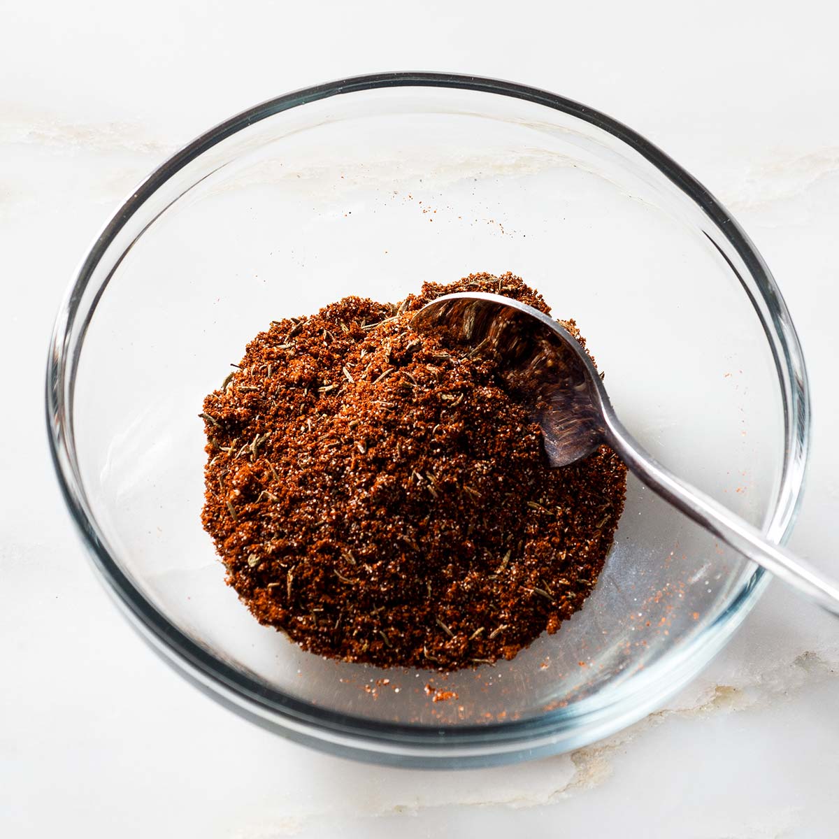 Espresso steak rub in a bowl with a spoon.