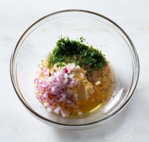 Dill honey mustard sauce ingredients in a bowl.