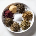 Garlic powder, sumac, salt, thyme, rosemary, marjoram, oregano and basil.