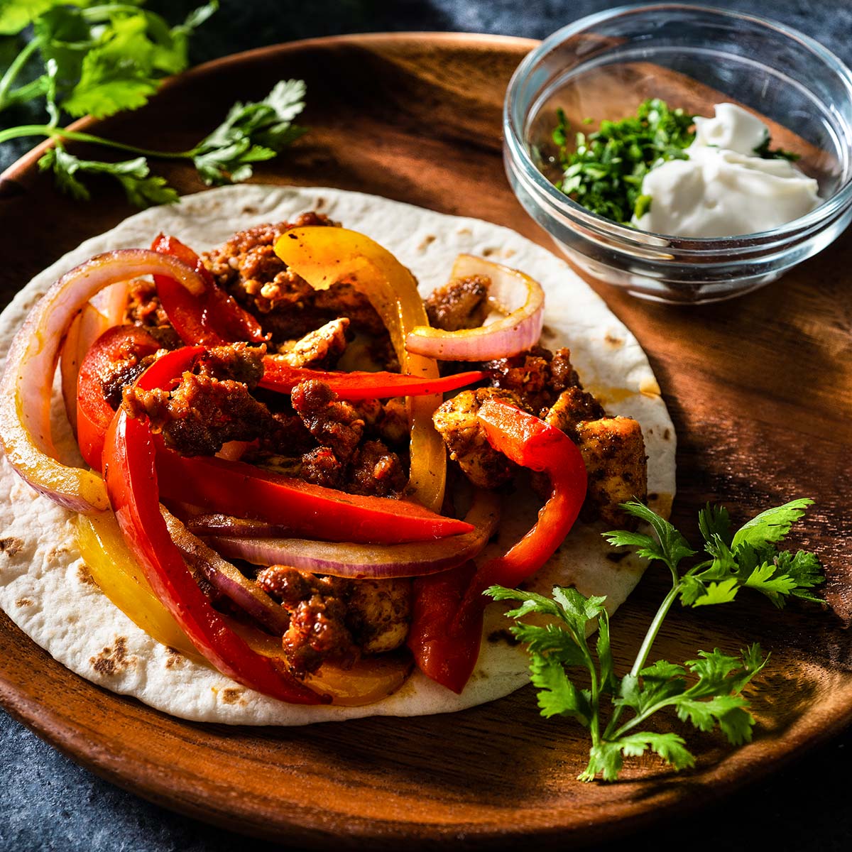 Chicken and chorizo fajita on a plate.
