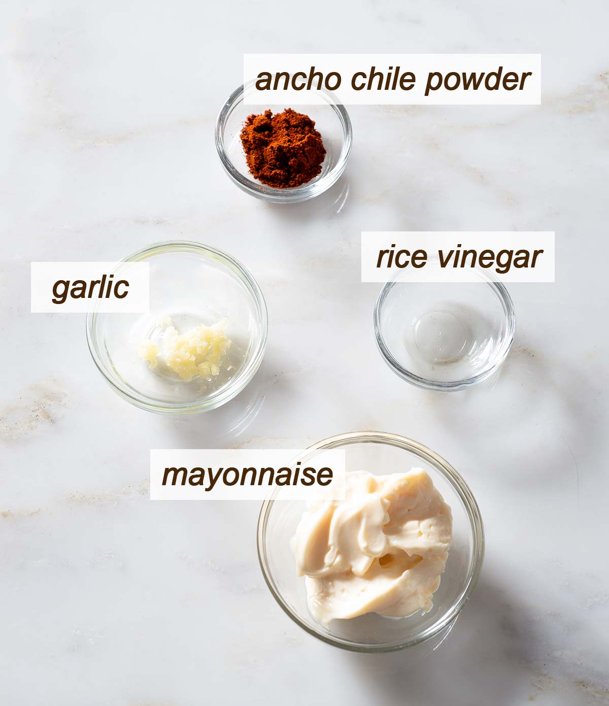 Mayonnaise, garlic, ancho chile powder and rice vinegar.