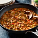 Bacon and chorizo pasta sauce in a non-stick pan.