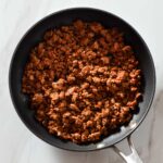 Seasoned ground turkey in a pan.